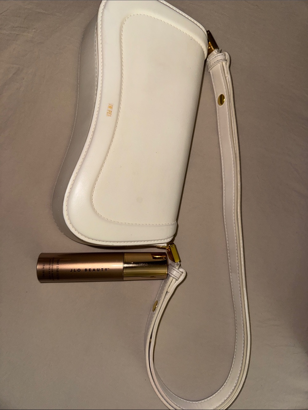 JW PEI White Shoulder Clutch + J.Lo Beauty “That Star Filter” complexion booster